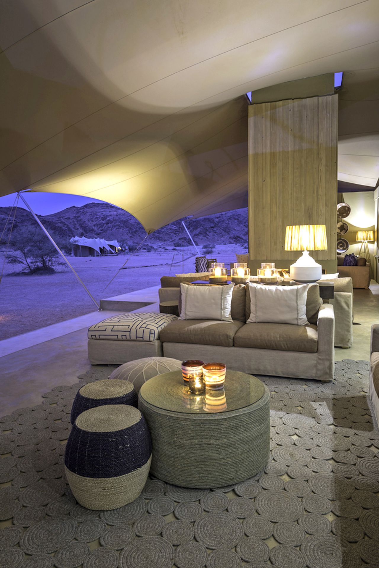 Accessible only by light aircraft, Hoanib Skeleton Coast Camp is a secluded tent resort in Namibia's mysterious Skeleton Coast. The 100% solar-powered camp features a swimming pool.