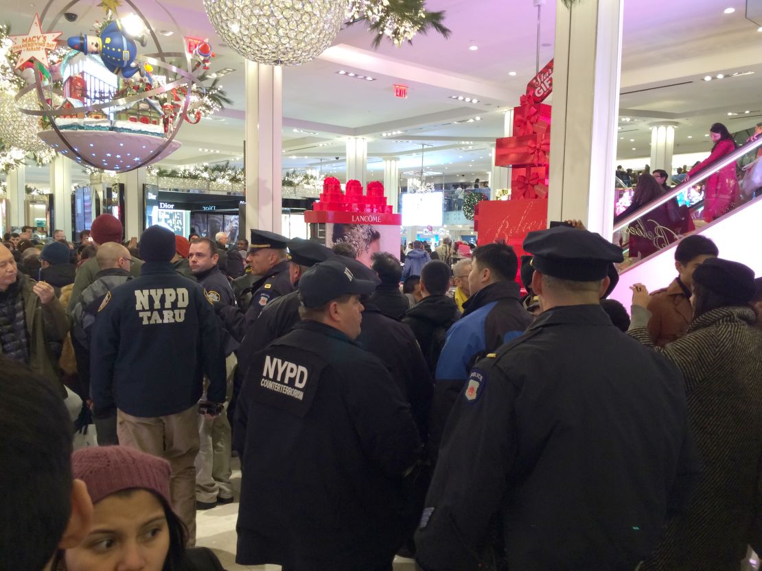 Demonstrators enter Macy's in Manhattan's Herald Square, urging shoppers to boycott Black Friday. 