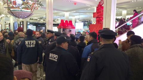 Demonstrators enter Macy's in Manhattan's Herald Square, urging shoppers to boycott Black Friday.
