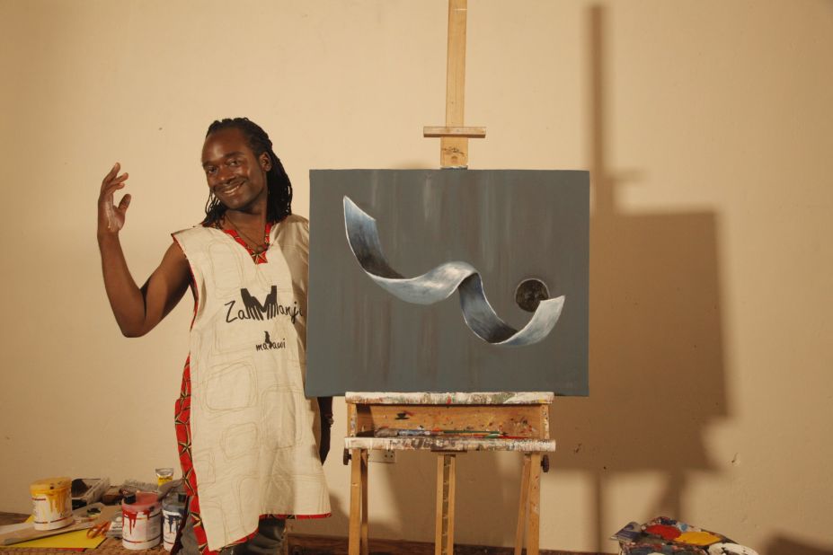Kambalu stands next to his piece "Fallen Angel" painted exclusively for CNN. Describing it afterwards, he says: "When I was told that at the very end I would paint for the cameras, I wanted to present to the world a kind of work that was fresh and quite new to the eye. I must confess that though I had an idea of what I needed to paint the colors were instantaneous. I found myself going for the violets, grays, whites, with some shock of pithalo blues. Fallen Angel is a depiction of space and movement, and it borders on fantasy." 