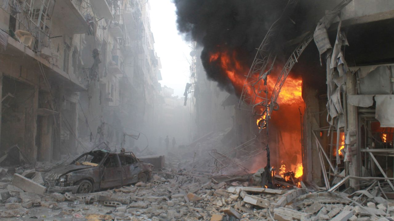 <strong>March 7:</strong> Debris covers a street in Aleppo, Syria, after a reported airstrike by Syrian government forces.
