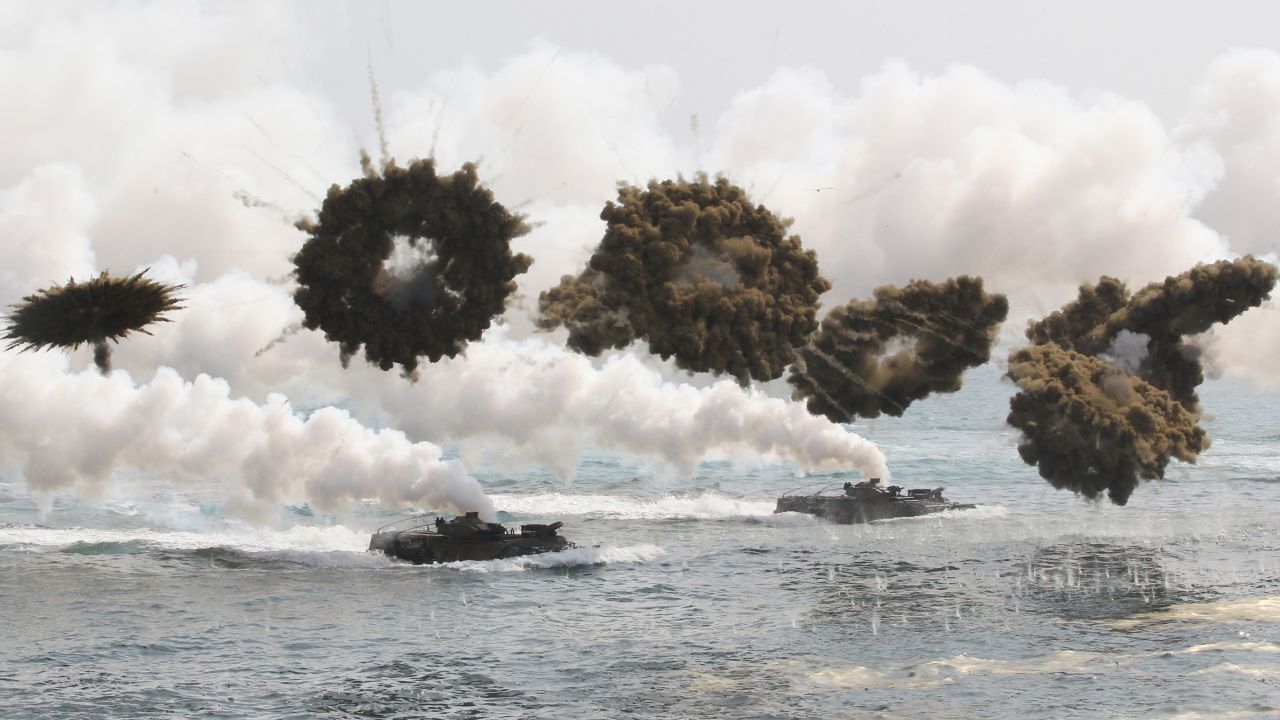 <strong>March 31:</strong> South Korean watercraft travel through smoke screens during a military exercise with U.S. forces in Pohang, South Korea.
