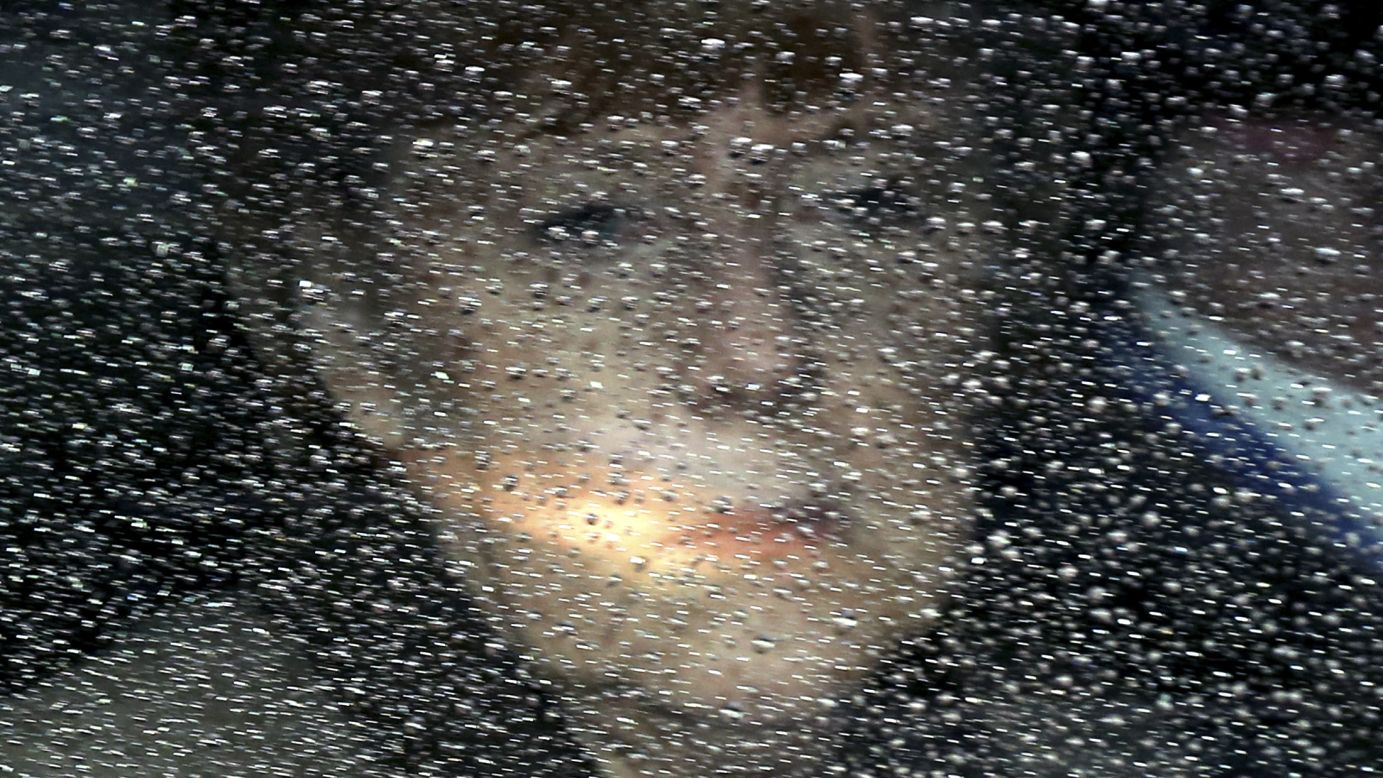 <strong>March 21:</strong> German Chancellor Angela Merkel looks through her window as she arrives at a European Union summit in Brussels, Belgium.