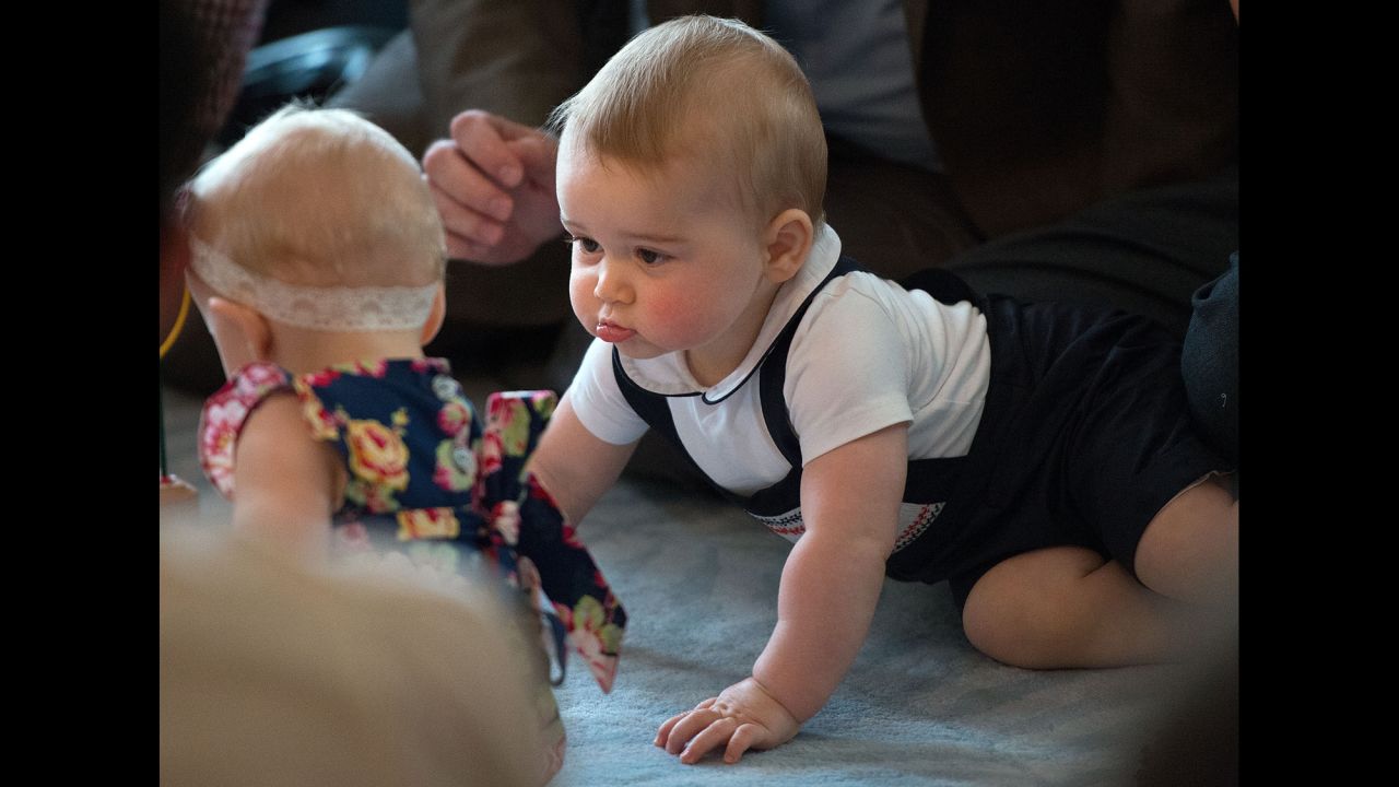 <strong>April 9:</strong> Britain's Prince George looks at other babies during an event at the Government House in Wellington, New Zealand. His parents, the Duke and Duchess of Cambridge, were on <a href="http://www.cnn.com/2014/04/06/world/gallery/royal-tour-new-zealand-australia/index.html">a three-week tour</a> of New Zealand and Australia. <a href="http://www.cnn.com/2014/07/11/world/gallery/prince-george-first-year/">See Prince George's first year in pictures</a>