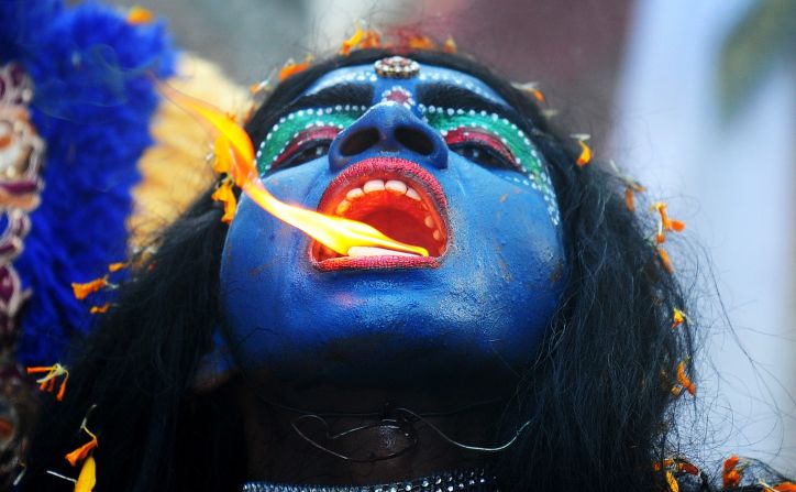 <strong>April 8: </strong>An artist dressed as the Hindu goddess Kali participates in a procession to celebrate the Ram Navami festival in Allahabad, India.