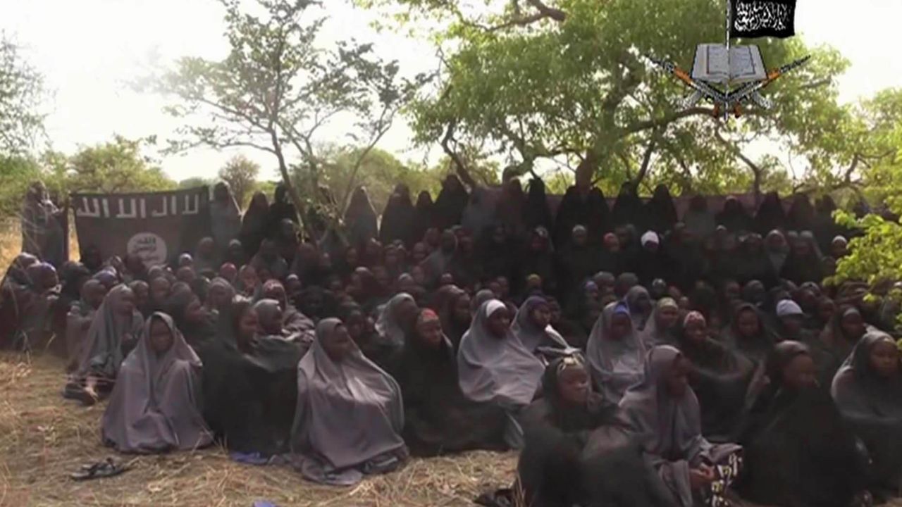 <strong>May 12:</strong> This image, taken from video shot by Boko Haram militants, allegedly shows the Nigerian schoolgirls that the group abducted in April. More than 200 girls were taken, <a href="http://www.cnn.com/2014/05/01/world/gallery/nigeria-girls-kidnapped/index.html">sparking a global outcry.</a> The Islamist militant group, whose name means "Western education is sin," <a href="http://www.cnn.com/2014/12/01/world/africa/nigeria-boko-haram-attack/index.html">later said it sold most of the girls into slavery.</a>
