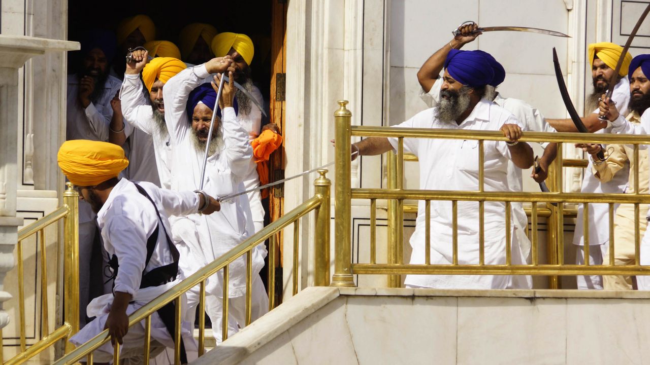 <strong>June 6:</strong> Members of a hardline Sikh group clash with guards of the Golden Temple, the religion's holiest shrine, in Amritsar, India. Half a dozen people were wounded, officials said.