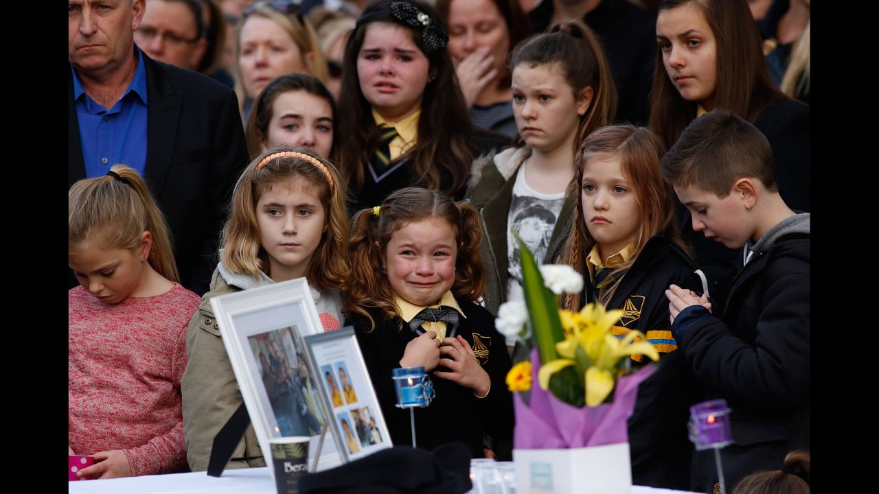 <strong>July 20:</strong> Mourners in Eynesbury, Australia, attend a memorial service for a family of five killed aboard Malaysia Airlines Flight 17. Johannes van den Hende, Shalize Zain Dewa and their children -- Piers, Marnix and Margaux -- were on the passenger plane when it was shot down.