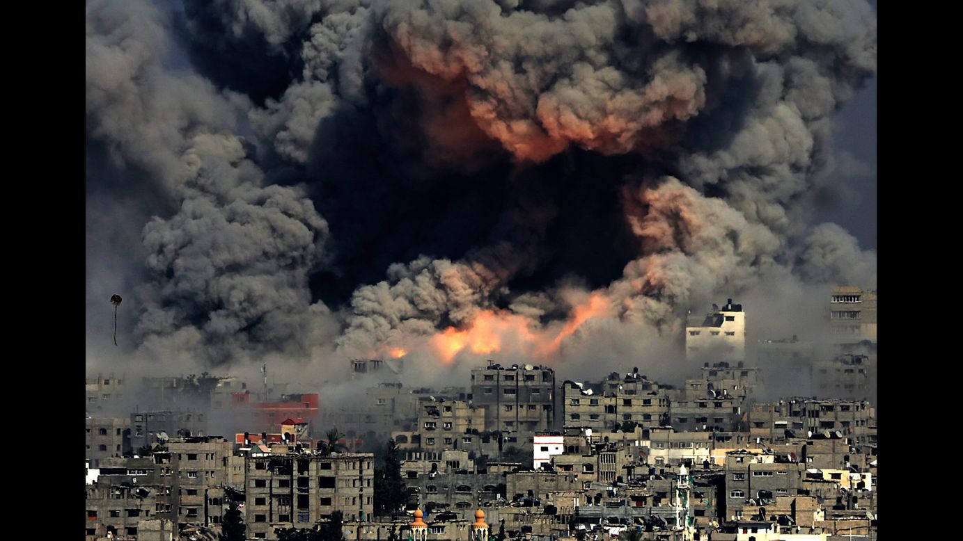 <strong>July 29:</strong> Smoke rises in Gaza City after Israeli airstrikes. Israel <a href="http://www.cnn.com/2014/07/18/world/gallery/israel-gaza/index.html">launched a ground operation in Gaza</a> after a 10-day campaign of airstrikes failed to halt relentless Hamas rocket fire on Israeli cities. After more than seven weeks of heavy fighting, Israel and Hamas agreed to an open-ended ceasefire that put off dealing with core long-term issues.