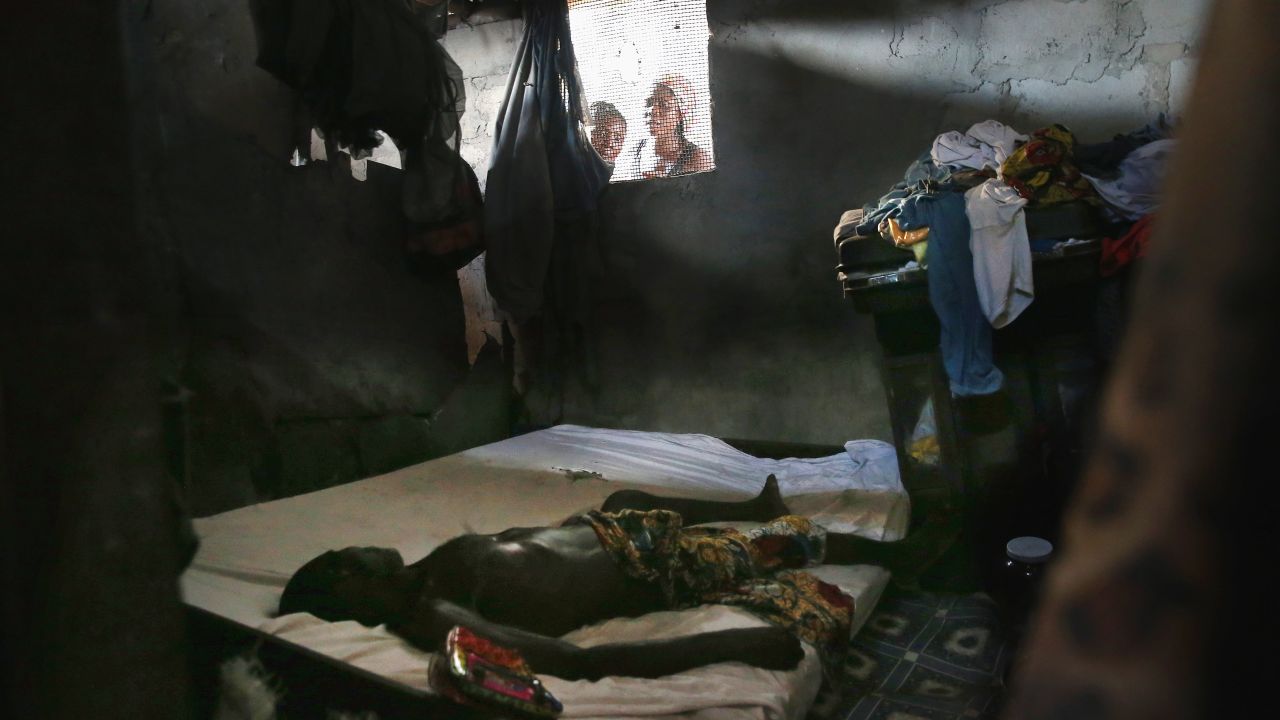 People peer into a bedroom in Monrovia as a dead body awaits the arrival of an Ebola burial team in October. Globally, the world's health leaders had to take another look at their own safety systems. The United Nations' health arm, the World Health Organization, <a href="http://www.who.int/dg/speeches/2015/executive-board-ebola/en/" target="_blank" target="_blank">admitted it was too slow to act</a>. Doctors Without Borders, a group that had a long-term presence in the region, says <a href="http://www.msf.org/article/ebola-pushed-limit-and-beyond" target="_blank" target="_blank">thousands of lives were lost </a>because of this inaction. Nonprofits with tight budgets had to fill in the gaps, and they <a href="https://www.oxfam.org/en/pressroom/pressreleases/2015-01-26/oxfam-calls-massive-post-ebola-marshall-plan" target="_blank" target="_blank">continue to sound the alarm</a>. 