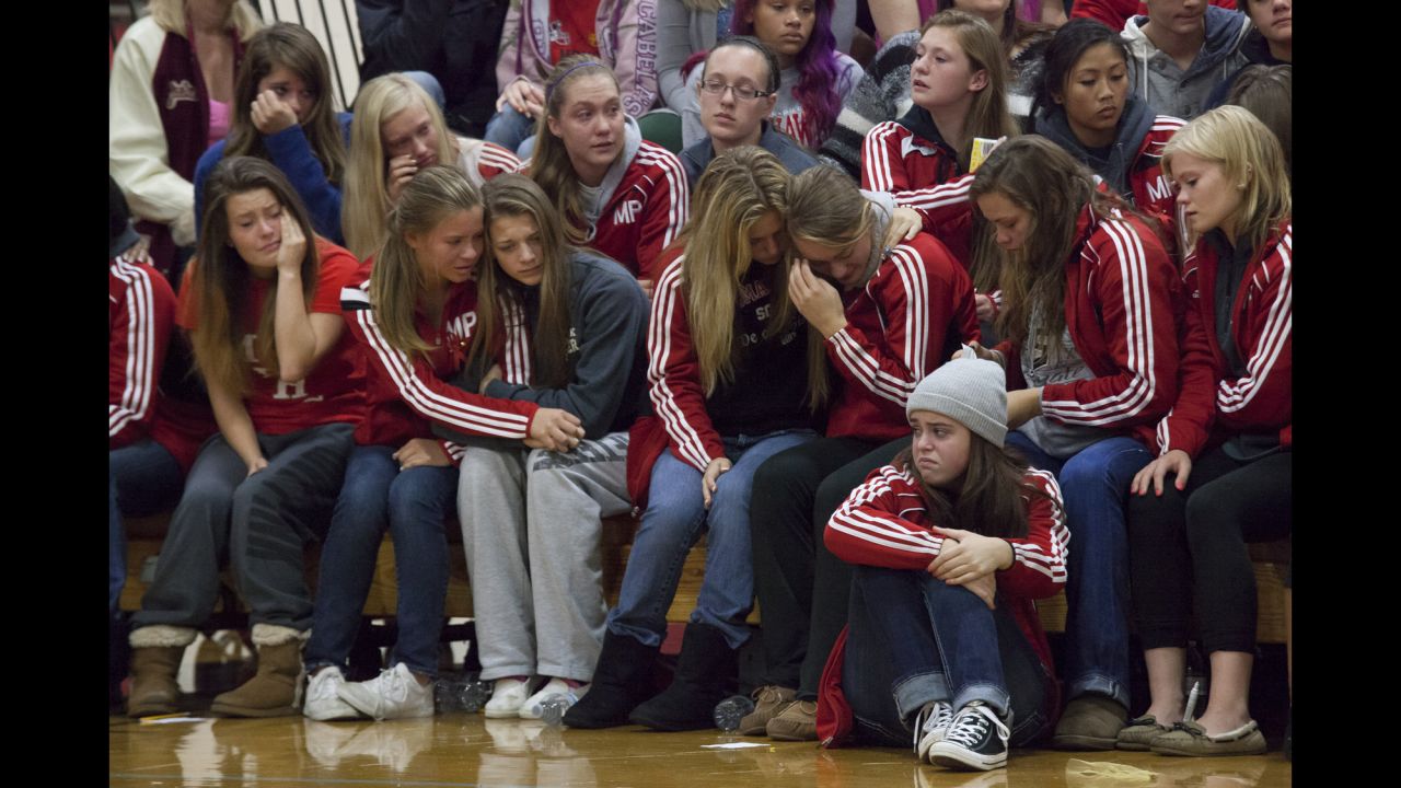 <strong>October 26: </strong>Students grieve during a gathering at Marysville-Pilchuck High School in Marysville, Washington. Law enforcement officials say Jaylen Fryberg, a popular freshman at the school, <a href="http://www.cnn.com/2014/10/24/us/gallery/washington-school-shooting/index.html">shot five fellow students</a> before committing suicide on October 24.