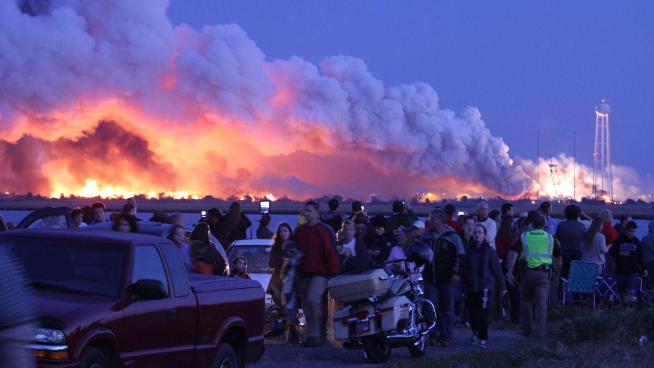 <strong>October 28:</strong> People who came to Wallops Island, Virginia, to watch the launch of a NASA-contracted rocket walk away after <a href="http://www.cnn.com/2014/10/29/us/gallery/antares-explosion/index.html">the unmanned spacecraft, owned by Orbital Sciences Corp., exploded.</a> The cargo module was carrying 5,000 pounds of supplies and experiments meant for the International Space Station. No one was injured in the explosion, and the cause is under investigation.