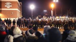 Police confront demonstrators outside the police station on November 28, in Ferguson, Missouri.