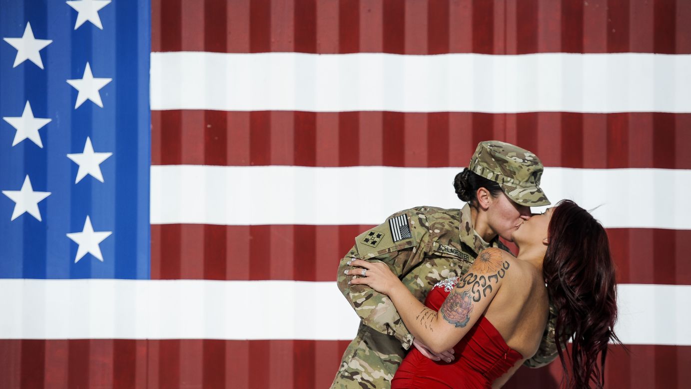 <strong>November 14:</strong> U.S. Army Spc. Sabryna Schlagetter kisses her wife, Cheyenne, after returning home to Fort Carson, Colorado, with other members of the 4th Infantry Brigade Combat Team. The couple married on Valentine's Day this year before Sabryna deployed to Afghanistan.