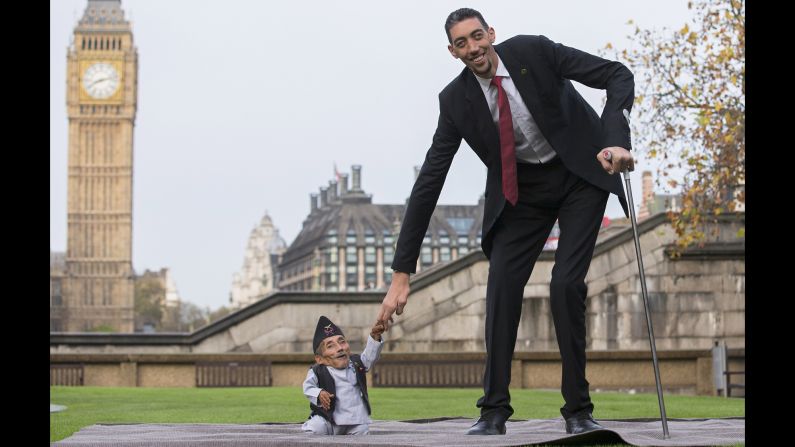 <strong>November 13:</strong> Chandra Bahadur Dangi, the shortest adult ever verified by Guinness World Records, poses with the world's tallest man, Sultan Kosen, in London. Dangi is 21 ½ inches tall, while Kosen is 8 feet, 3 inches tall.