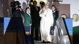 Pope Francis waves as he embarks a plane for Rome at the Istanbul Ataturk airport, on Sunday November 30, concluding his three day visit the the largely Muslim country.