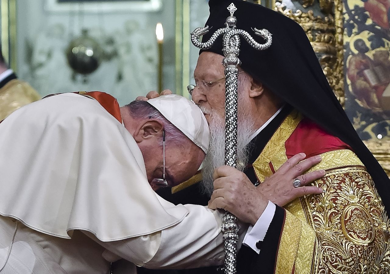 Ecumenical Patriarch Bartholomew I kisses the Pope during an ecumenical prayer at the Patriarchal Church of St. George in Istanbul on Saturday, November 29. 