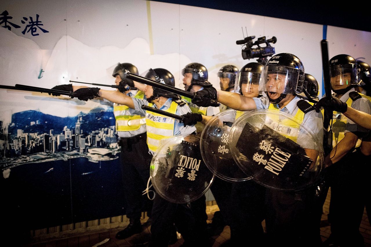 Police prepare to face protesters on Lung Wo Road outside Hong Kong's Government complex on November 30.