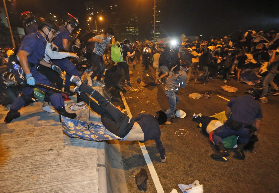 Hundreds of pro-democracy protesters face off with Hong Kong police on November 30. 