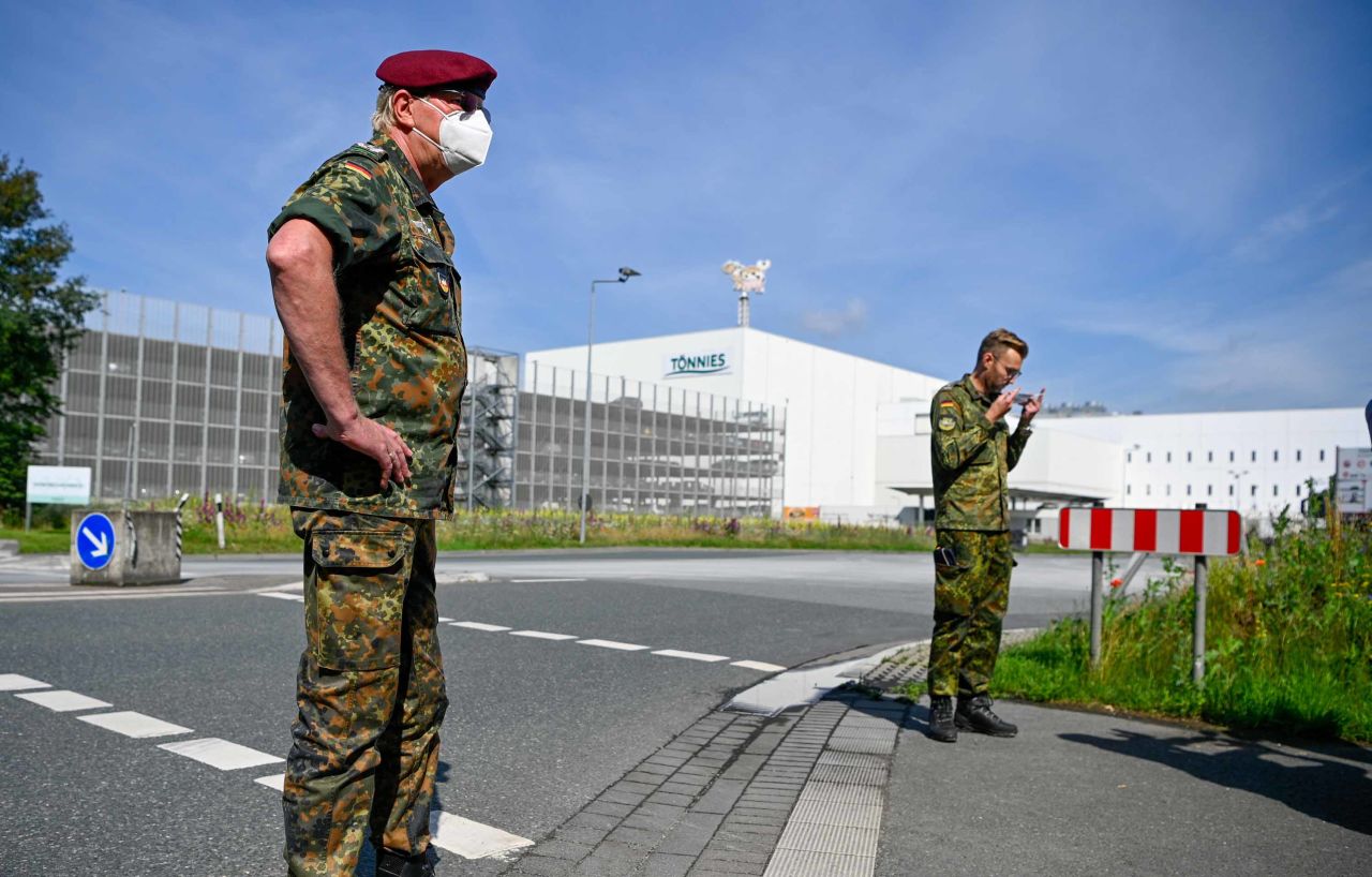 Members of the German armed forces prepare to help with taking throat swab samples for Covid-19 testing of employees at the Toennies meat packing plant in Guetersloh, Germany on June 19. 