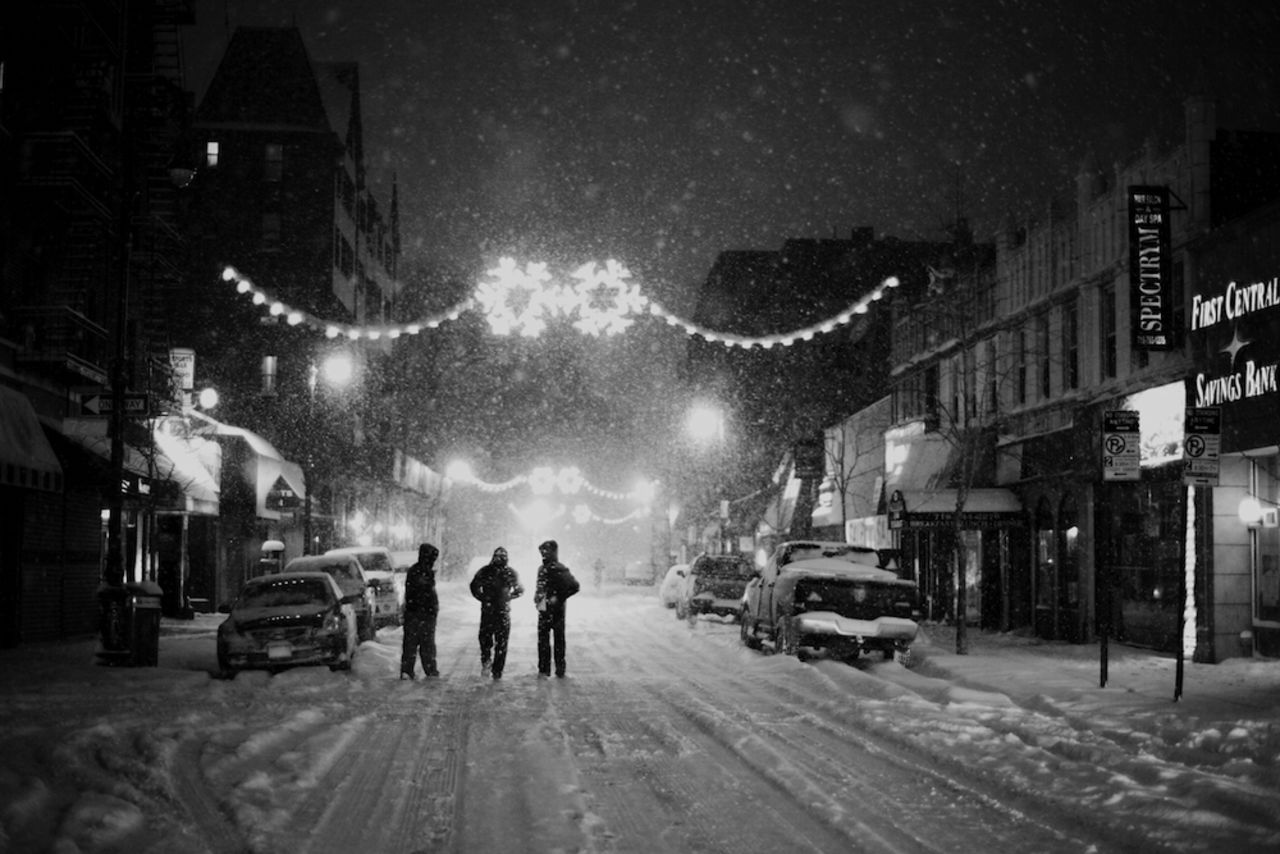 <a href="http://ireport.cnn.com/docs/DOC-1077804">Alicia Kwoka </a>captured this shot in January of pedestrians in the streets of Queens in the midst of a steady snowfall. Kwoka said the peaceful street was a stark contrast to the usually busy New York environment.