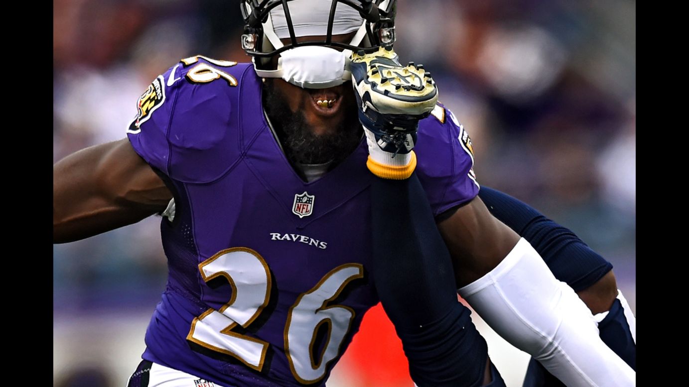 Baltimore Ravens safety Matt Elam catches a cleat in the face while playing the San Diego Chargers on Sunday, November 30.