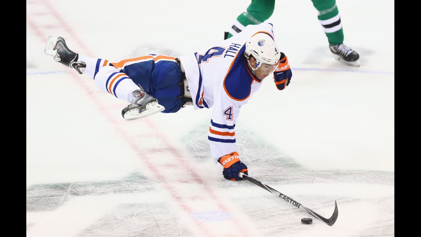 Taylor Hall of the Edmonton Oilers is tripped during an NHL game in Dallas on Tuesday, November 25.