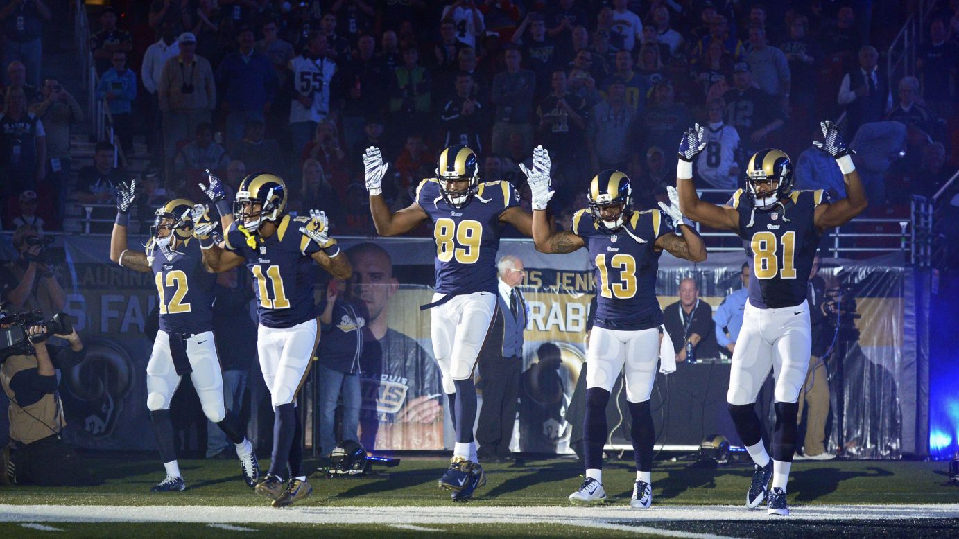 From left, St. Louis Rams Stedman Bailey, Tavon Austin, Jared Cook, Chris Givens and Kenny Britt <a href="http://www.cnn.com/2014/12/01/us/ferguson-nfl-st-louis-rams/index.html">put their hands up</a> before playing the Oakland Raiders on Sunday, November 30. The gesture was meant to show support for Michael Brown, the teenager who was killed in the St. Louis suburb of Ferguson. Some say that Brown had his arms up when police officer Darren Wilson shot him to death in August. Others, including Wilson, say Brown was actually attacking Wilson. A grand jury decided not to indict Wilson, leading to <a href="http://www.cnn.com/2014/11/25/justice/gallery/national-ferguson-protests/index.html">protests nationwide.</a>