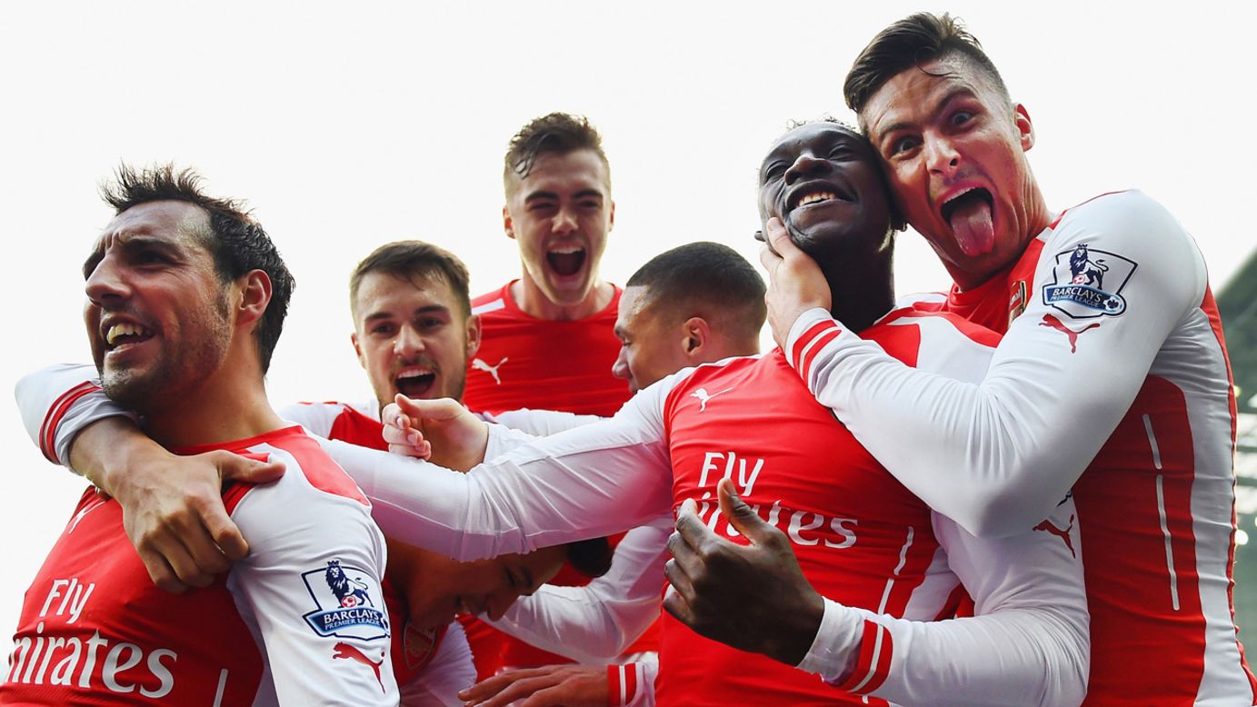 Arsenal players celebrate after Danny Welbeck, second from right, scored against West Bromwich Albion during a Premier League match Saturday, November 29, in West Bromwich, England. It was the only goal of the match.