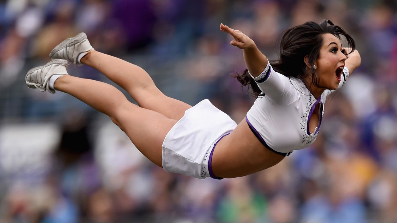 A Baltimore Ravens cheerleader performs for the home crowd on Sunday, November 30.
