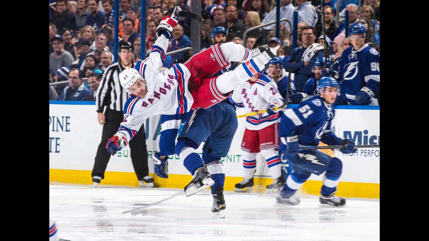 New York Rangers defenseman Dan Boyle goes airborne after he was checked by a Tampa Bay player on Wednesday, November 26.