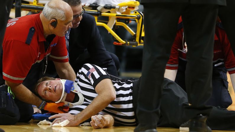 Medical personnel attend to college basketball official Rick Crawford after he was accidentally struck by a player's elbow during a game between La Salle and Vanderbilt on Saturday, November 29. He was stretchered off the court and taken to the hospital, but he later returned to the arena and <a href="index.php?page=&url=http%3A%2F%2Fwww.philly.com%2Fphilly%2Fsports%2Fcolleges%2Fla_salle%2F20141130_Official_Rick_Crawford__good__after_taking_elbow_to_head_in_La_Salle_game.html" target="_blank" target="_blank">said he was "good,"</a> according to Marc Narducci of the Philadelphia Inquirer.