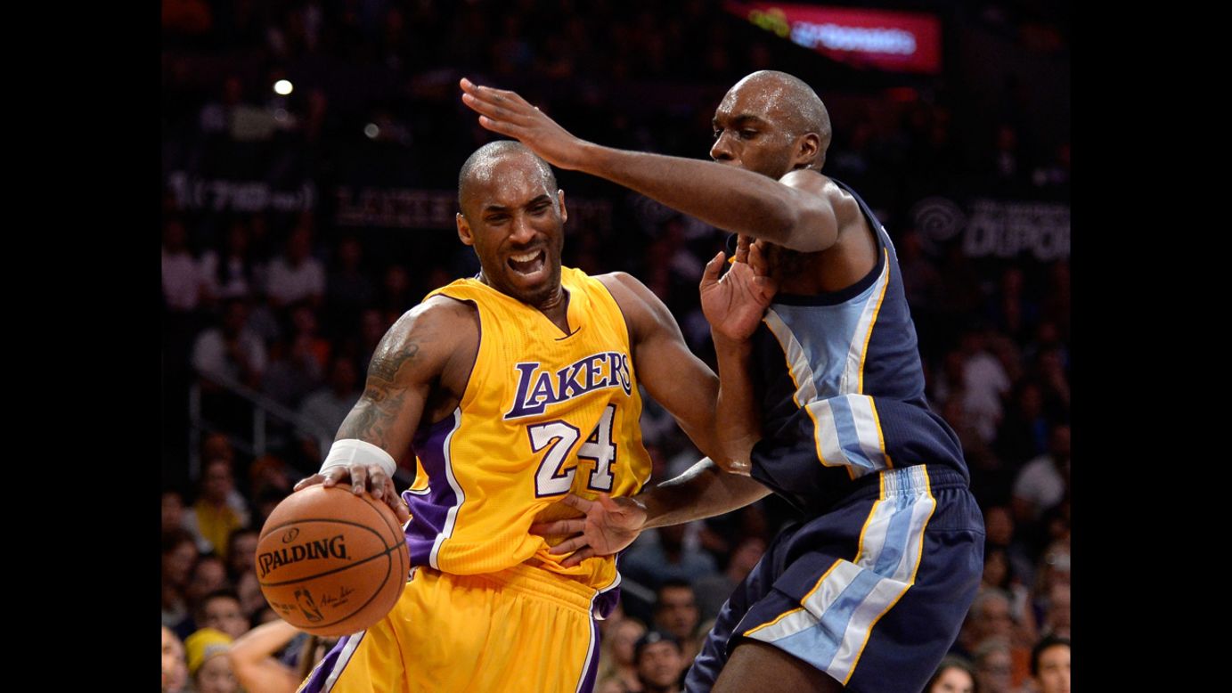 Kobe Bryant of the Los Angeles Lakers is fouled by Memphis' Quincy Pondexter during an NBA game played Wednesday, November 26, in Los Angeles.