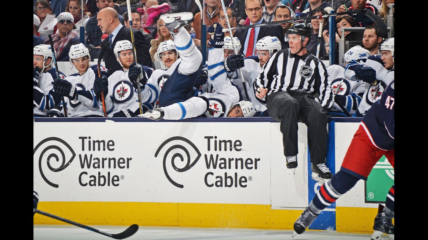 Winnipeg's Evander Kane falls into his bench while playing the Columbus Blue Jackets on Tuesday, November 25.