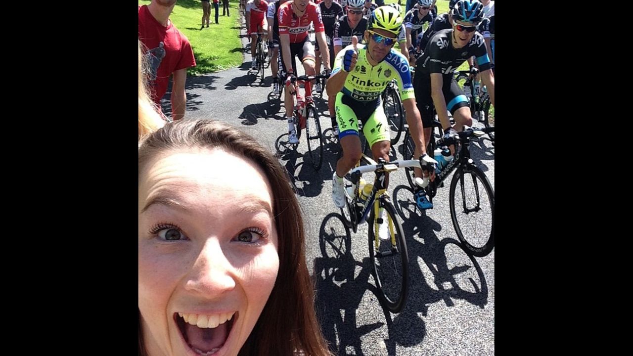 Cyclist Alberto Contador gives a thumbs-up while fan Katie Holroyde <a href="http://instagram.com/p/qEiCoWSNal/?modal=true" target="_blank" target="_blank">takes a selfie</a> Saturday, July 5, at the start of the Tour de France in Leeds, England. One of the Tour's charms has been allowing fans to get close to the action for free, but some cyclists this year <a href="http://edition.cnn.com/2014/07/07/sport/tour-de-france-britain-selfies-kittel/">have complained about fans taking selfies</a> and not paying attention to the dangers they pose.