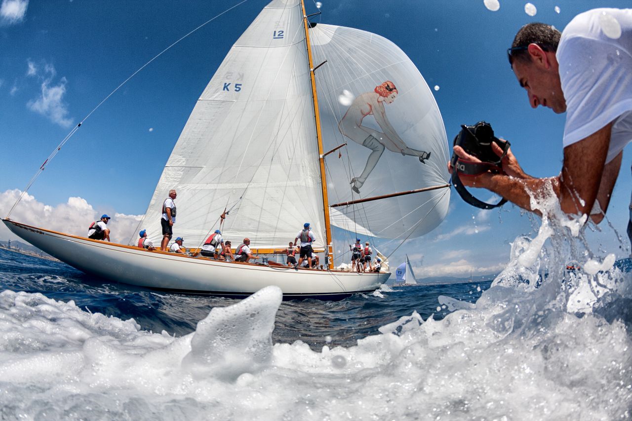 A pair of photographers are in close quarter action on a downwind leg of the Puig Vela Classica off Barcelona to produce an unusual visual effect.