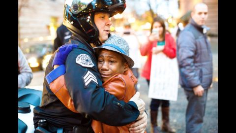 12-year-old Devonte Hart hugs Sgt. Bret Barnum.