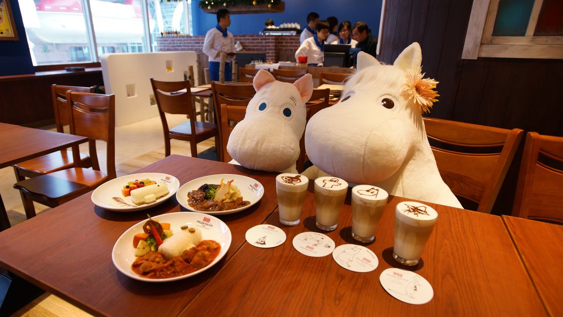 Far left: creamy Hattifattener-shaped cheesecake with fresh fruit and custard sauce. Top: Venison stew. Bottom: Hattifattener plate with chicken tomato ragout. Drinks: Moomin character lattes