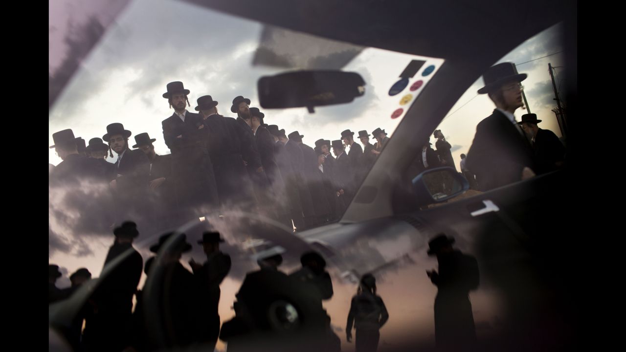 <strong>October 2: </strong>Ultra-Orthodox Jews of the Hasidic sect Vizhnitz gather on a hill overlooking the Mediterranean Sea as they participate in a Tashlich ceremony in Herzliya, Israel. Tashlich, which means "to cast away" in Hebrew, is the practice by which Jews go to a large flowing body of water and symbolically "throw away" their sins by throwing a piece of bread, or similar food, into the water before <a href="http://www.cnn.com/2013/09/13/world/gallery/yom-kippur/index.html">the Jewish holiday of Yom Kippur.</a>