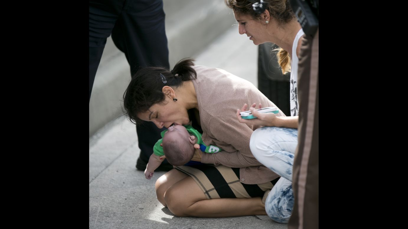 <strong>February 20:</strong> <a href="http://www.cnn.com/2014/02/21/us/gallery/miami-baby-rescue/index.html">Pamela Rauseo performs CPR</a> on her 5-month-old nephew, Sebastian de la Cruz, after pulling over on the side of a Miami highway. She was stuck in traffic when the infant stopped breathing. Sebastian was taken to the hospital in critical condition, but he survived.