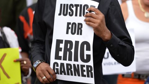 Demonstrators rally against police brutality in memory of Eric Garner on Staten Island in 2014. 