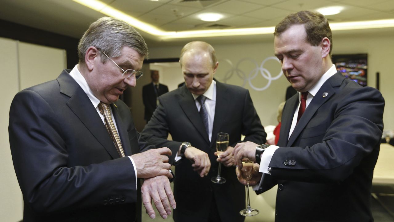 <strong>February 23:</strong> From left, International Olympic Committee President Thomas Bach, Russian President Vladimir Putin and Russian Prime Minister Dmitry Medvedev look at their watches before the <a href="http://www.cnn.com/2014/02/23/world/gallery/olympic-closing-ceremony/index.html">closing ceremony of the Winter Olympics</a> in Sochi, Russia.