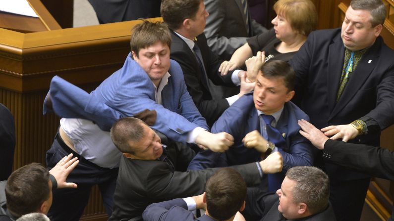 <strong>April 8:</strong> Lawmakers scuffle during a parliament session in Kiev, Ukraine. The fight broke out when Petr Simonenko, the leader of the Communist Party, began to say lawmakers should listen to the demands of eastern Ukraine. He defended demonstrators who seized local government buildings, saying they are not doing anything different from what the interim government had done. He also accused "nationalists" of starting the crisis in eastern Ukraine.