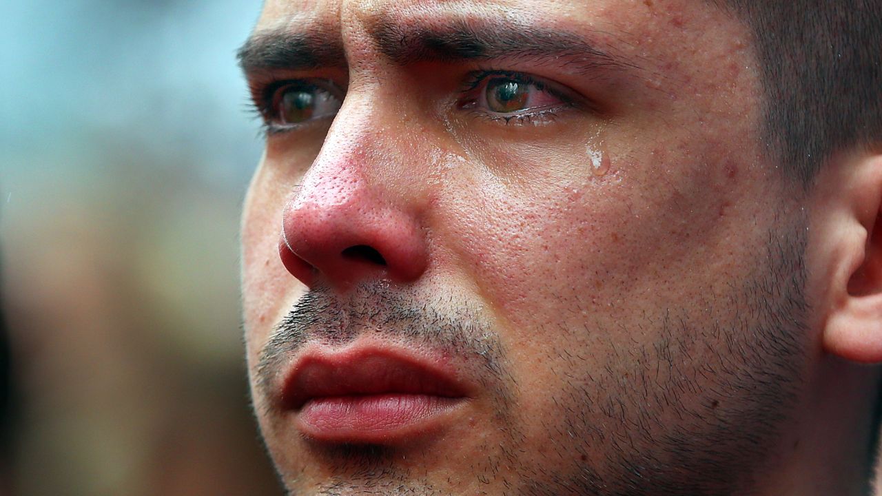 <strong>April 15:</strong> Boston University student Sebastian Filgueira-Gomez has tears in his eyes during a moment of silence for the<a href="http://www.cnn.com/2014/04/15/us/gallery/boston-bombing-memorial/index.html"> one-year anniversary of the Boston Marathon bombings</a>. He was standing on Boston's Boylston Street, a block from the marathon's finish line.