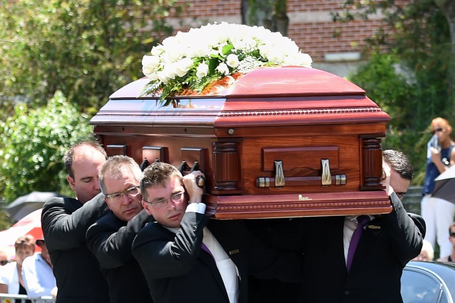 Pallbearers carry the coffin of Australian batsman Phil Hughes ahead of his funeral in his home town of Macksville in northern New South Wales on December 3.