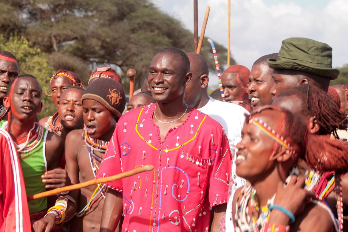 As well as the backing of local elder tribes, the Maasai Olympics also has the endorsement of popular local and national celebrities.<br /><br />Here, Kenyan 800 meters gold medal winner at the  2012 Olympic Games in London, David Rudisha (himself a member of the Maasai ethnic group and patron of the Maasai Olympics) meets competitors.