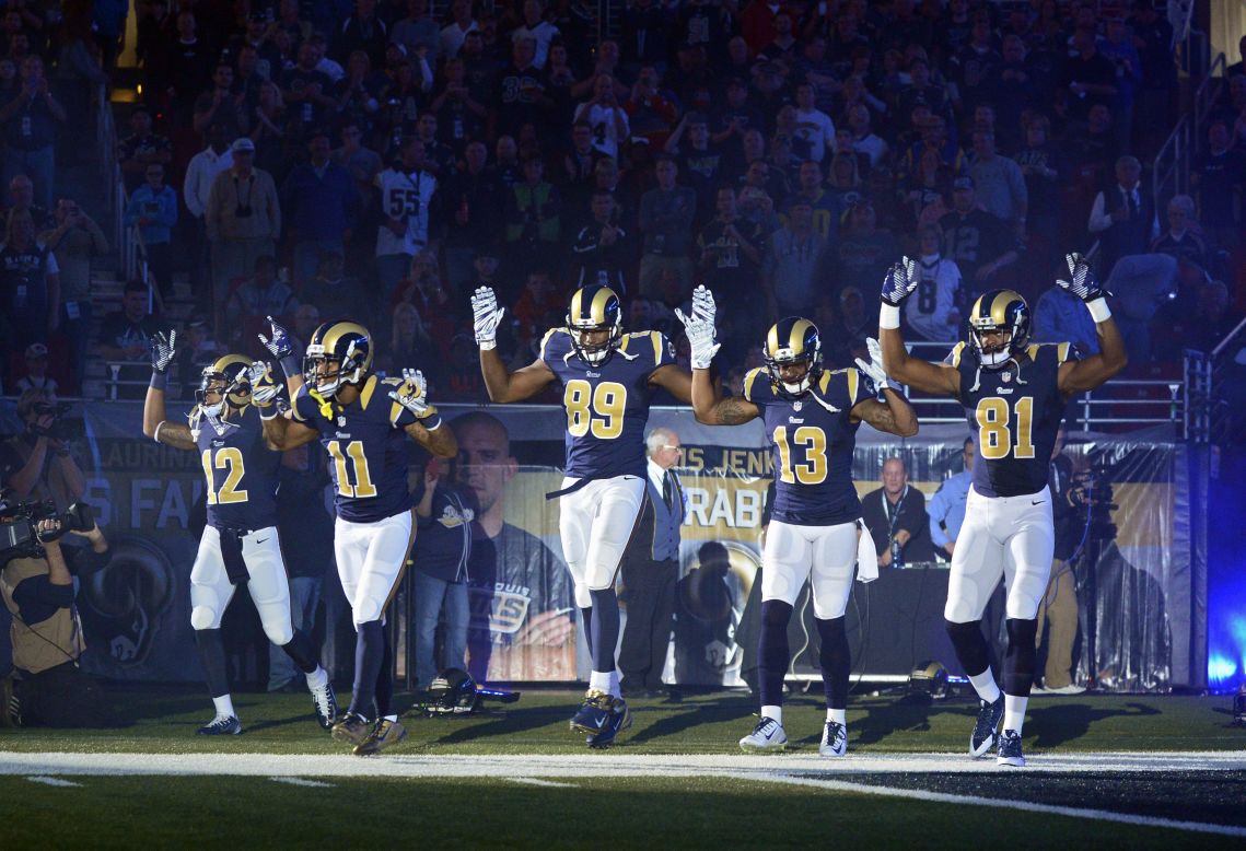 <strong>November 30:</strong> From left, St. Louis Rams Stedman Bailey, Tavon Austin, Jared Cook, Chris Givens and Kenny Britt put their hands up before playing the Oakland Raiders in St. Louis. <a href="http://www.cnn.com/2014/12/01/us/ferguson-nfl-st-louis-rams/index.html">The gesture</a> was meant to show support for Michael Brown, the teenager who was killed in the St. Louis suburb of Ferguson.