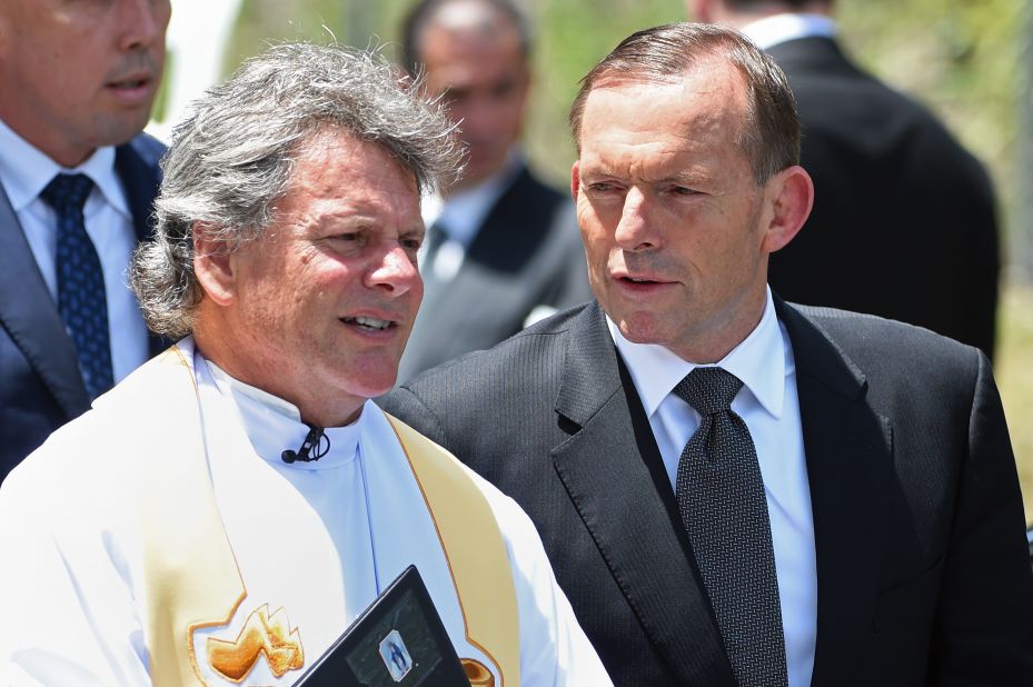 Australia Prime Minister Tony Abbott (right) arrives for the funeral of Australian cricket batsman Phil Hughes in Macksville, northern New South Wales on December 3.