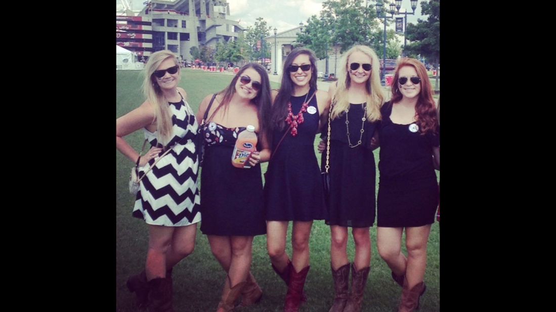At the University of South Carolina, Southern gentlemen "allow our ladies to take the spotlight," says student <a href="http://ireport.cnn.com/docs/DOC-1187880">Byron Thomas</a>, who shot this photo of his friends. Girls typically wear garnet or black sundresses paired with "cowgirl" boots. "You'll see a lot of girls walking home barefoot because the cowgirl boots hurt their feet from all the standing and jumping," Thomas said.