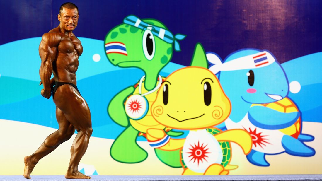 Chinese bodybuilder Xin Jian poses during competition Friday, November 21, at the Asian Beach Games in Phuket, Thailand.